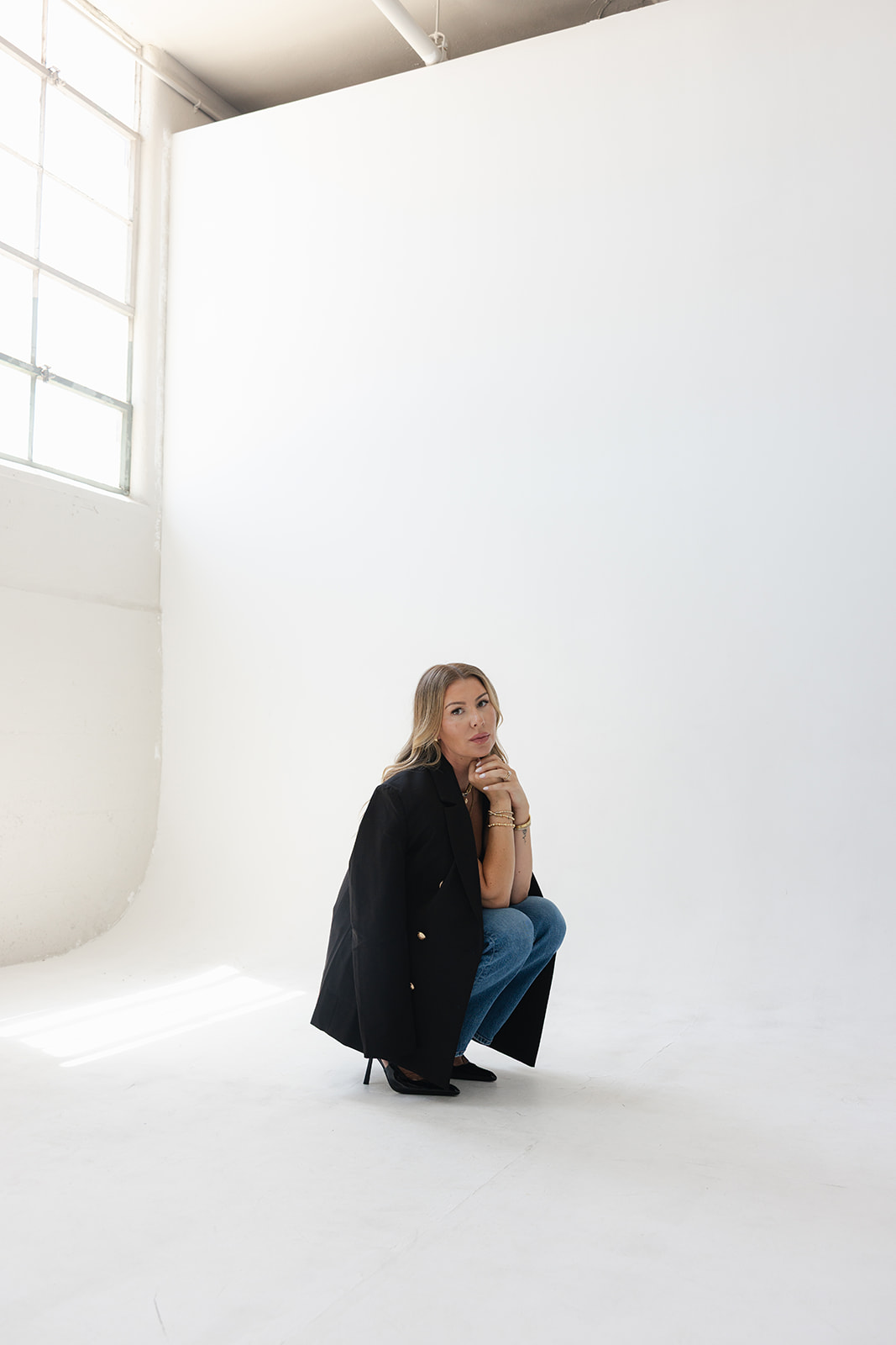 White blazer, sheer wide-leg trousers — editorial occasion styling